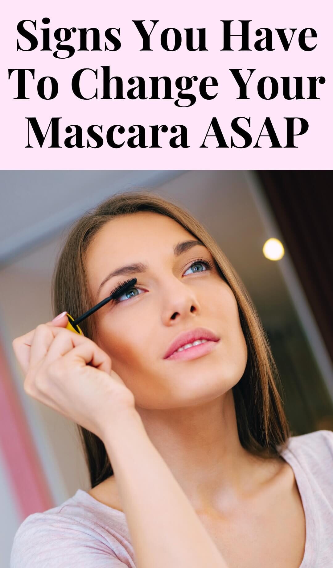 Woman uses freshly opened mascara