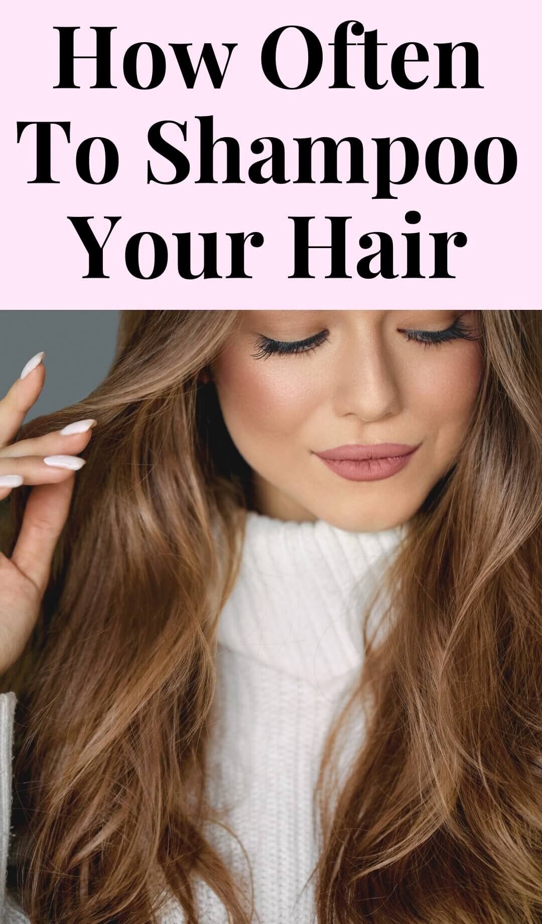 Woman touches her clean brunette hair